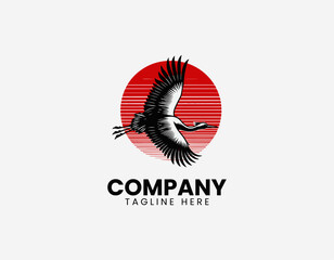 Fototapeta premium Flying crane bird with red sun black vector illustration