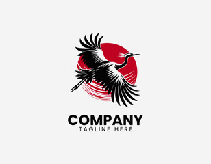 Fototapeta premium Flying crane bird with red sun black vector illustration