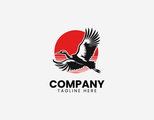 Fototapeta premium Flying crane bird with red sun black vector illustration