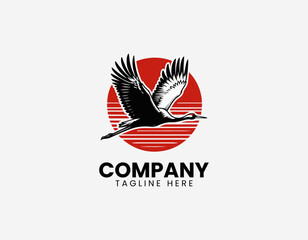 Fototapeta premium Flying crane bird with red sun black vector illustration