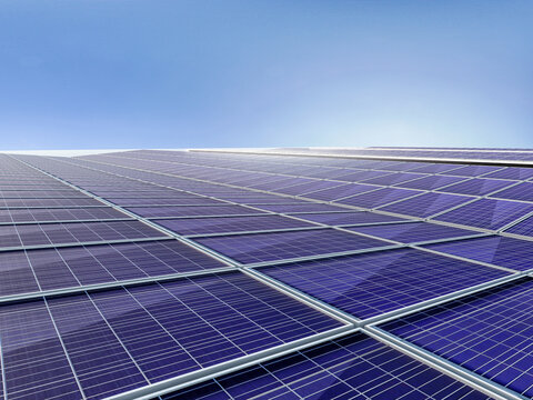 High-resolution 3D visualization of a contemporary solar carport design. The image shows multiple rows of parking spaces covered with photovoltaic panels on a clean concrete surface. Ideal for themes 