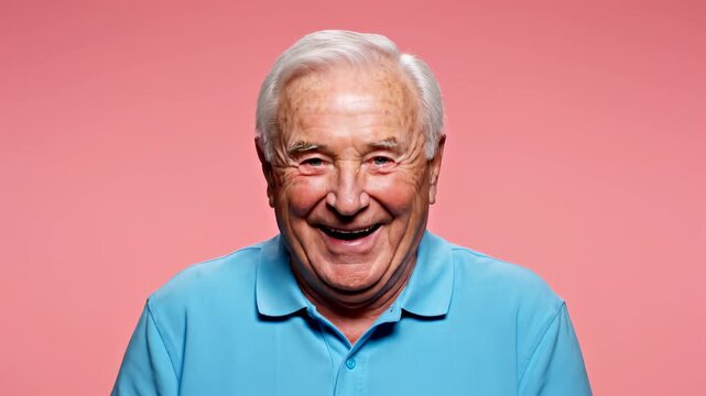 Joyful Elderly Man Laughing Heartily on Pink Background.