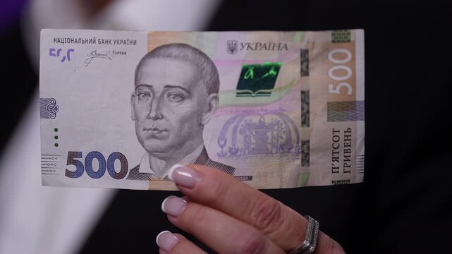 Obverse, front side Ukrainian banknote hryvnia 500 UAH note , featuring a detailed portrait and visible security elements. The image captures financial concept, cash transaction.