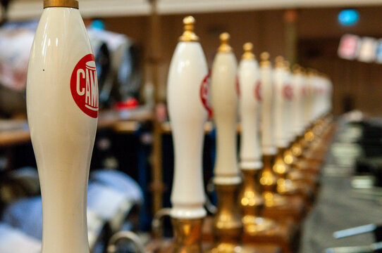 Row of beer pumps at a CAMRA (Campaign for Real Ale) beer and cider festival