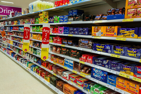 Chocolates and sweets on shelves in a Tesco store