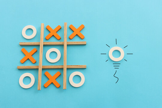 Concept image of unique thinking. Puzzle game cube in the shape of light bulb