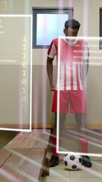 Vertical video: Player starting right foot by soccer ball, practicing drills, AR UI over him