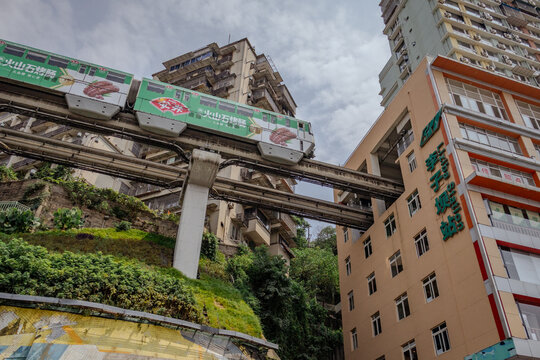Famous Liziba station with a subway car traveling through a building. Located in Chongqing, China