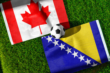 Naklejka premium Canada vs Bosnia and Herzegovina, national flags before world championship Group B group stage match, football on green pitch with goal in the background, Toronto, Canada, June 12, 2026