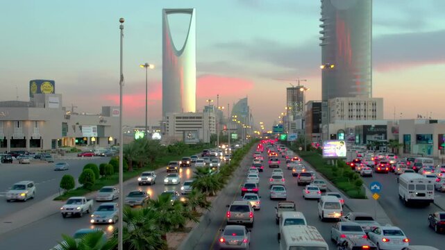 Riyadh City Skyline Aerial View Featuring Kingdom Tower and Heavy Traffic Flow on King Fahd Road, Saudi Arabia.