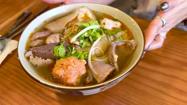 Vietnamese Bun Bo Hue Spicy Beef Noodle Soup Served in Bowl