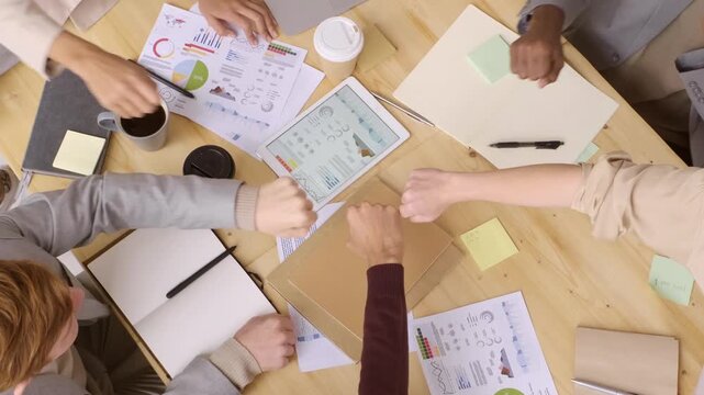A Group of People Doing Fist Bump