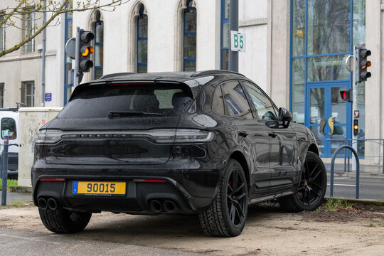 Nancy, France - April 2nd 2022 : View on a black Porsche Macan GTS with black rims parked on a parking lot.