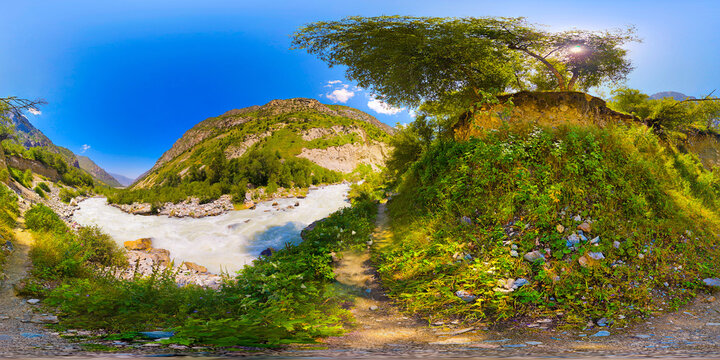 Panoramic 360 degrees view of river valley with mountains and trees near hiking footpath