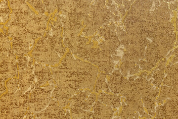 Fototapeta premium Luxurious golden marble texture with metallic veins. Elegant bronze abstract background for premium interior design, high-end wallpaper, or sophisticated wedding stationery and branding projects.