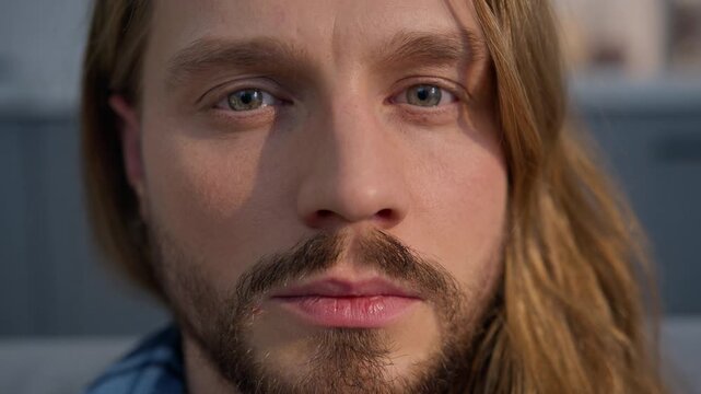 Tired Caucasian man lying sofa at home homeowner resting waking up calm serious portrait close up indoors apartment renter relaxing health nap leisure male guy looking at camera expression healthcare