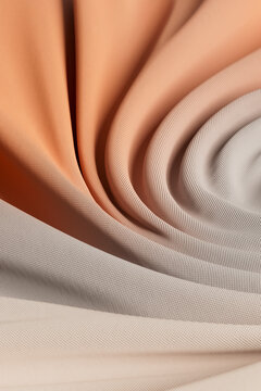 3D sand fabric spiral with woven texture and warm folds