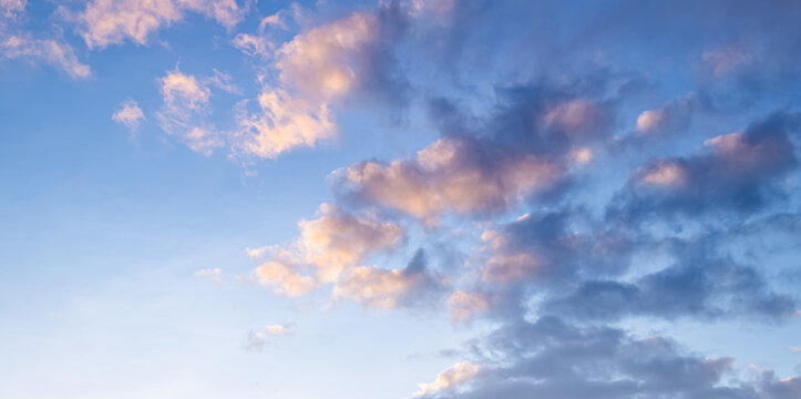 Beautiful sunset sky with golden clouds background and blue atmosphere natural dramatic sunrise cloudscape