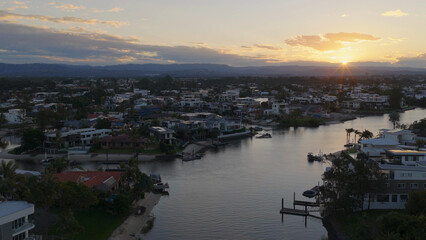 Fototapeta premium Aerial View of Gold Coast Canals and Residential Houses at Sunset