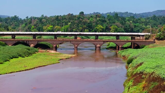 Hardoor Bridge with harangi river and greenery at Anjanageri Bettageri, Karnataka, india. day time, push in shot, drone shot, 4k.