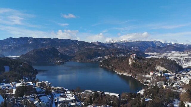 Cinematic aerial, Island Buildings, Alpine Landscapes, Historic Architecture, Bled Town, Slovenia