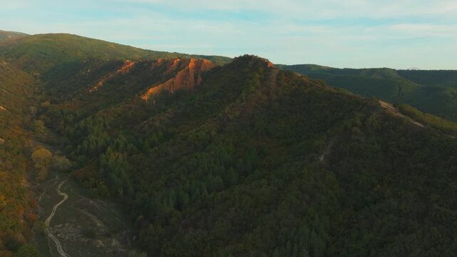 Stob Pyramids glowing during a stunning sunrise aerial view over the Rila mountain in Bulgaria, a famous tourist landmark
