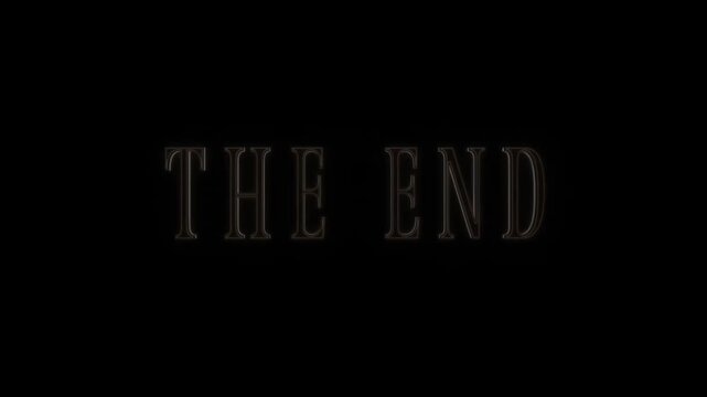 Slow fade out static shot of glowing the end title text dimming and fading into black background on cinema screen