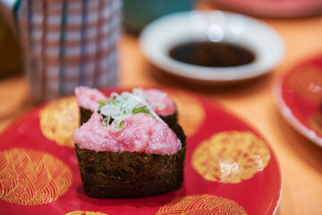 fatty tuna Gunkan Maki sushi on dish in Japanese restaurant © Blanscape