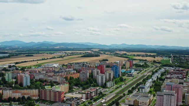 Wide aerial drone shot over housing estate in ostrava city with mountains landscape