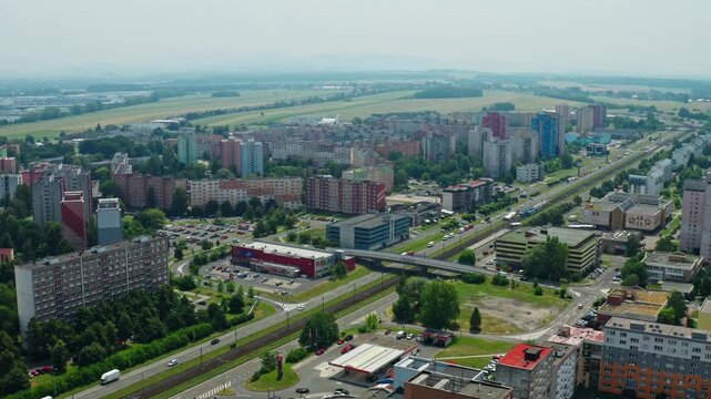 Wide aerial drone shot over housing estate in ostrava city with cars on road