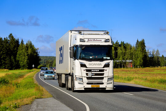 White Scania R540 Truck Semi Trailer Transports Load in Highway Traffic. 