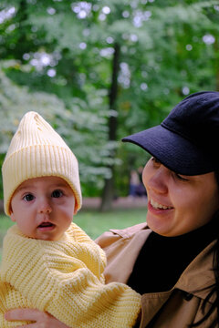 Mother and Baby in Yellow Outfit Outdoors Autumn season