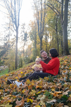 Family Enjoying Autumn Day in Forest Copy Space