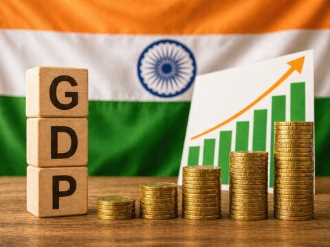 GDP text blocks coins and chart in front of Indian flag suggesting economic growth.