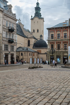 Historic european town square with church tower and cobblestones Lviv Ukraine