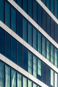 Abstract geometry pattern on modern building facade architecture with diagonal glass structure as a bold background for corporate business branding and design