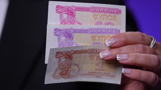 Ukrainian coupon banknotes (karbovanets Obverse -Heads). The colorful paper currency with historical design elements represents economic transition, in