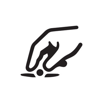 Hand gently placing or retrieving a small item with care and precision on a designated spot