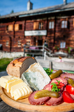 Traditional Austrian Brettljause snack board at an alpine hut