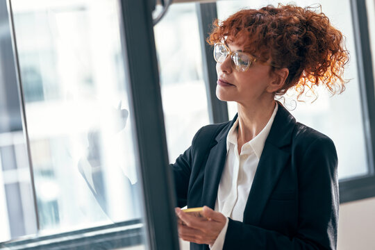 Woman entrepreneur planning business strategy in office
