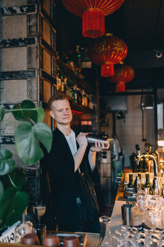 Bartender mixing cocktail in Japanese style bar