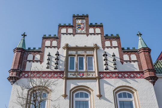 Historic house facade in T�nning Germany under a blue sky
