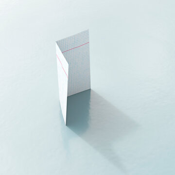 Standing folded checkered paper casting a shadow in 3D rendering