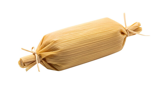 A traditional tamale wrapped in corn husk on transparent background