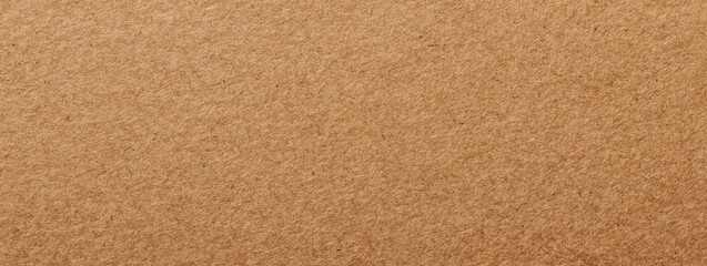 Fototapeta premium Brown kraft paper background offering a textured surface for crafting and design projects.