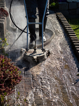 Hot Water Pressure Washer Cleaning Stone Patio Surface