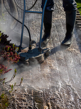 Hot Water Pressure Washer Cleaning Stone Patio Surface