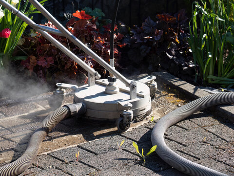 Hot Water Pressure Washer Cleaning Stone Patio Surface