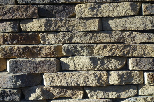 Texture of rugged dry stack stone veneer wall