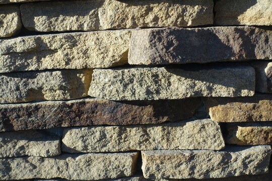 Texture of rugged dry stack stone veneer wall